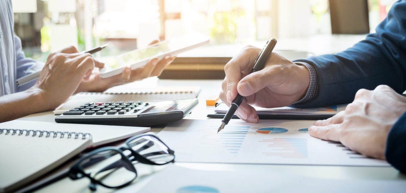 business-man-financial-inspector-and-secretary-making-report-calculating-or-checking-balance-internal-revenue-service-inspector-checking-document-audit-concept-e1635147822675