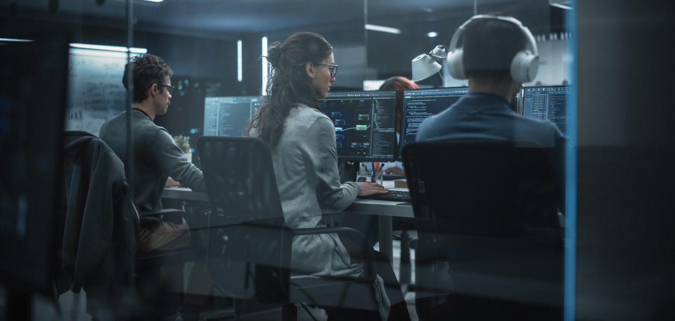 Group of Multicultural Men and Women Working in a Research Center, Collaborating and Discussing a Project, Using Computers to Write Advanced Software Code, Develop Artificial Intelligence Service Group of Multicultural Men and Women Working in a Research Center, Collaborating and Discussing a Project, Using Computers to Write Advanced Software Code, Develop Artificial Intelligence Service