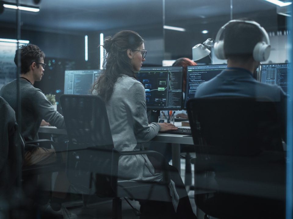 Group of Multicultural Men and Women Working in a Research Center, Collaborating and Discussing a Project, Using Computers to Write Advanced Software Code, Develop Artificial Intelligence Service Group of Multicultural Men and Women Working in a Research Center, Collaborating and Discussing a Project, Using Computers to Write Advanced Software Code, Develop Artificial Intelligence Service